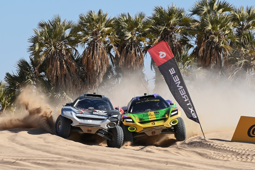 MARCH 12: Christine 'GZ' Giampaoli Zonca (ESP) / Timo Scheider (DEU), Carl Cox Motorsport, battles with Cristina Gutierrez (ESP) / Fraser McConnell (JAM), X44 Vida Carbon Racing during the Desert X-Prix on March 12, 2023. (Photo by Sam Bagnall / LAT Images)