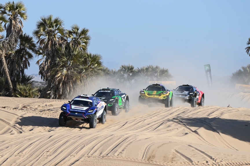 MARCH 12: Catie Munnings (GBR) / Timmy Hansen (SWE), Andretti Altawkilat Extreme E, leads Molly Taylor (AUS) / Kevin Hansen (SWE), Veloce Racing, and Cristina Gutierrez (ESP) / Fraser McConnell (JAM), X44 Vida Carbon Racing during the Desert X-Prix on March 12, 2023. (Photo by Sam Bagnall / LAT Images)