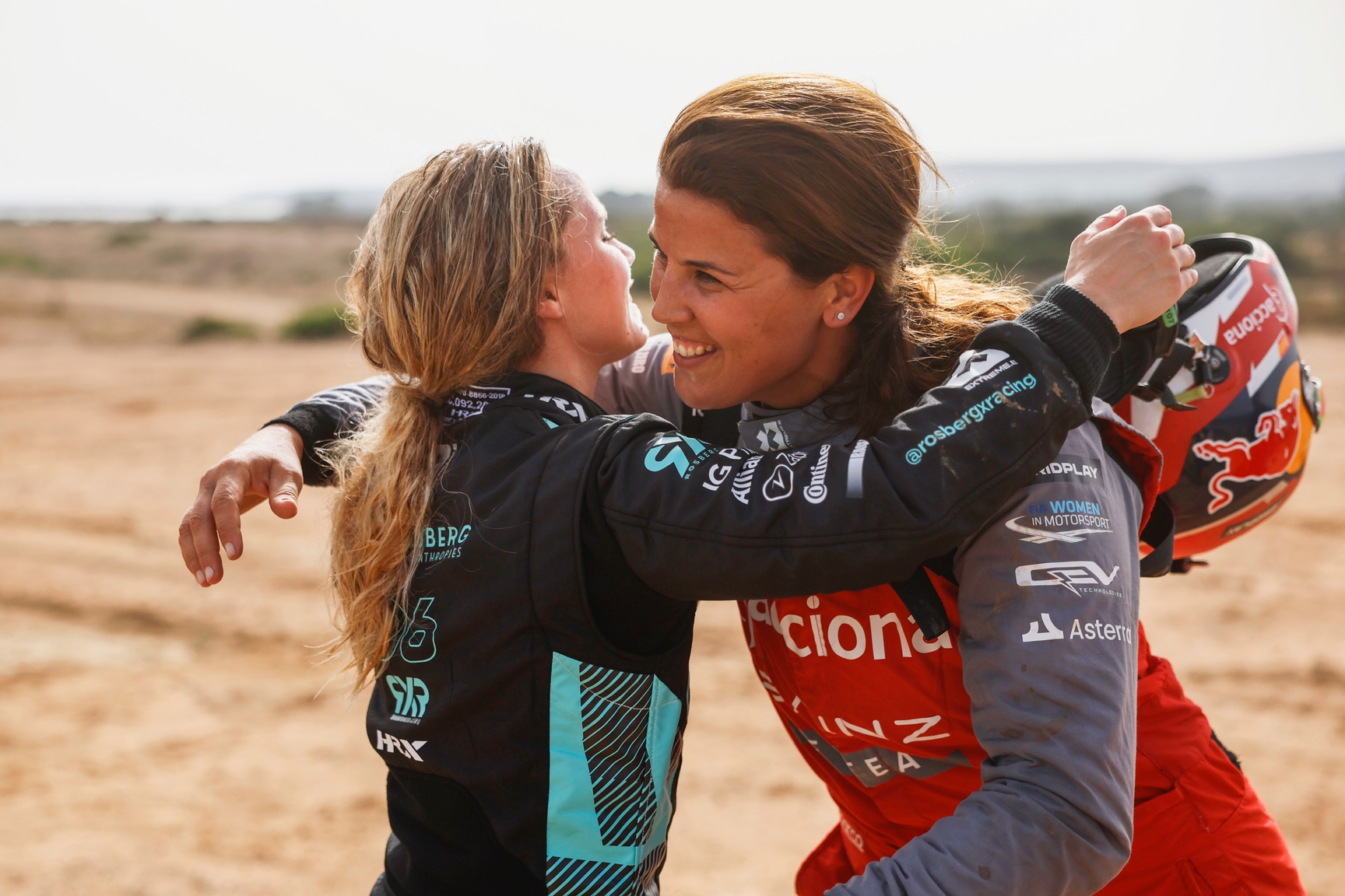 JULY 09: Mikaela Ahlin-Kottulinsky (SWE), Rosberg X Racing, 1st position, is congratulated by Laia Sanz (ESP), Acciona | Sainz XE Team, 2nd position, in Parc Ferme during the Island X-Prix on July 09, 2023. (Photo by Sam Bloxham / LAT Images)