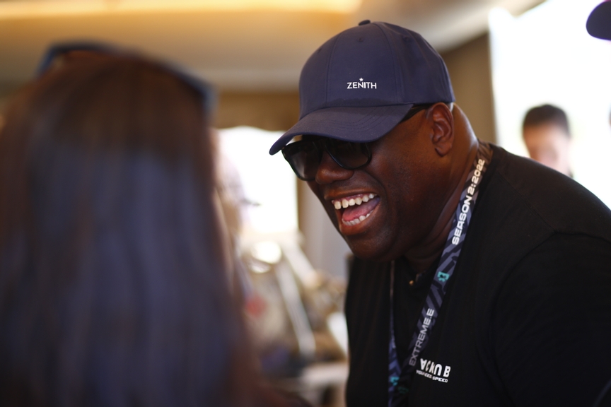 CAPO TEULADA, SARDINIA, ITALY - JULY 10: DJ Carl Cox having a tour of the garages  Sara Price (USA), Chip Ganassi Racing during the Sardinia II on July 10, 2022 in Capo Teulada, Sardinia, Italy. (Photo by Sam Bloxham / LAT Images)